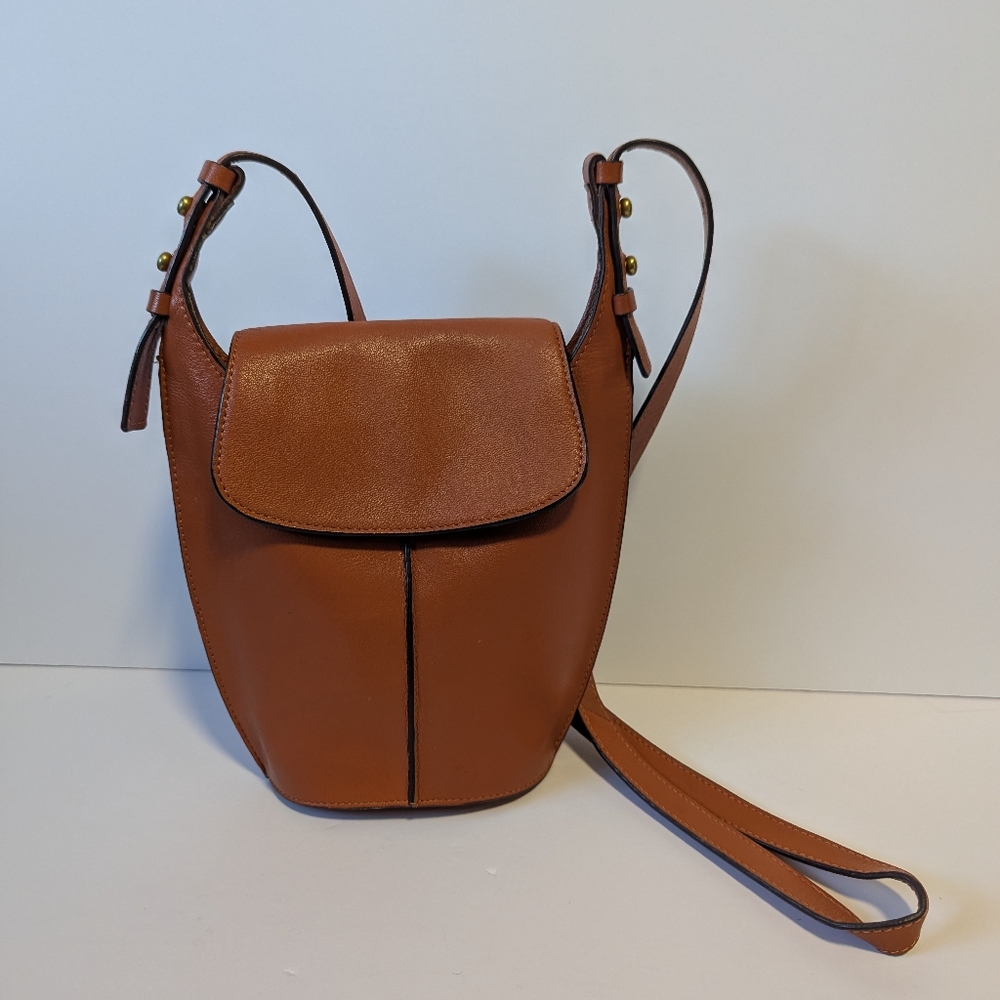 Lucky Brand leather adjustable strap crossbody handbag in a rust or tan color. 